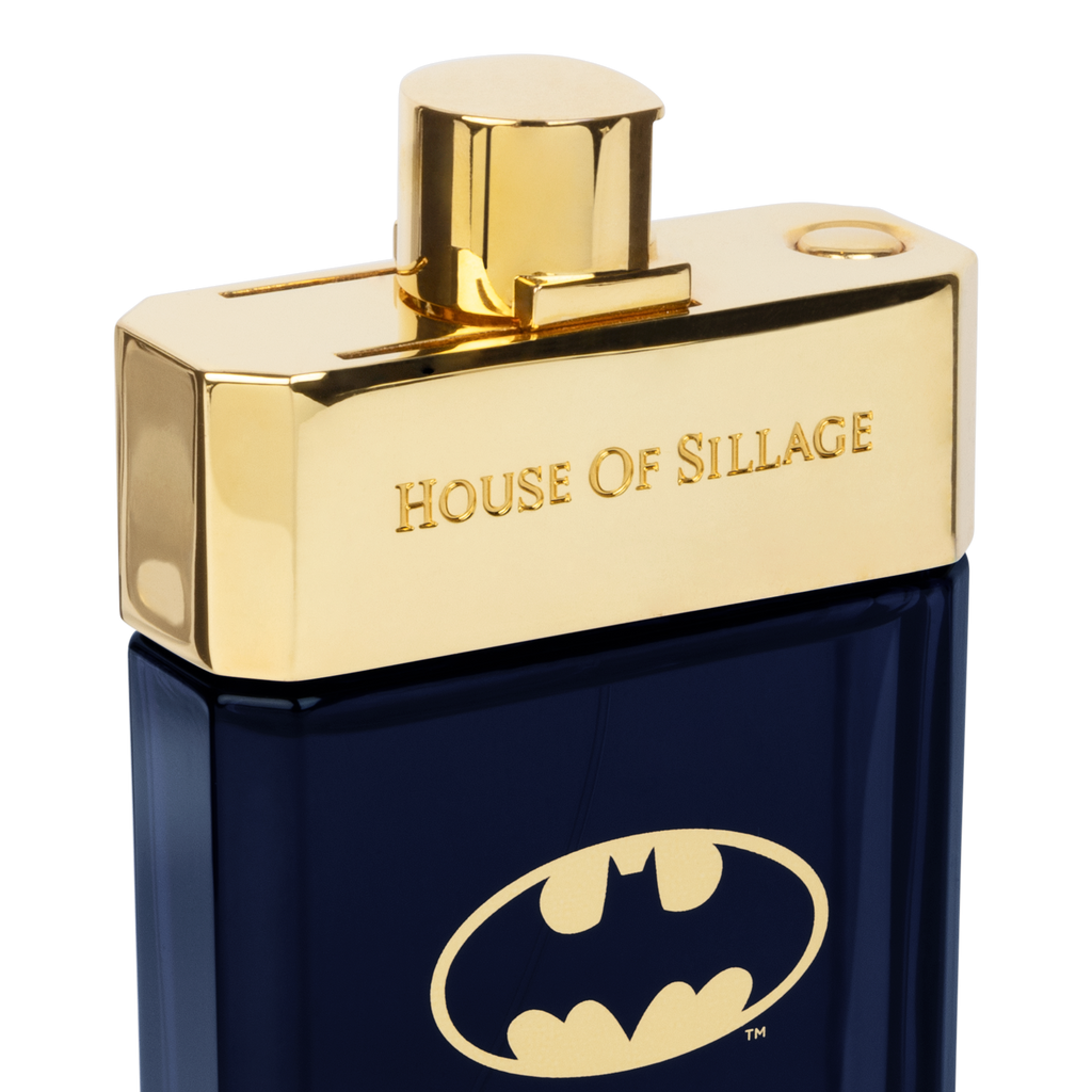 Luxury Men’s Fragrance in a sleek dark bottle, crowned with a golden cap, featuring the iconic Batman emblem on the front
