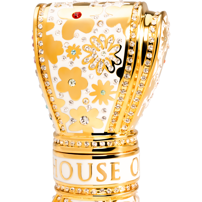 Gold and white decorative  luxury lipstick with floral patterns and 'House of' branding on a white background