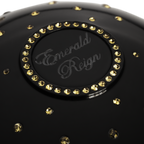 Black luxury fragrance cup with gold crystals  and 'Emerald Reign' branding 
