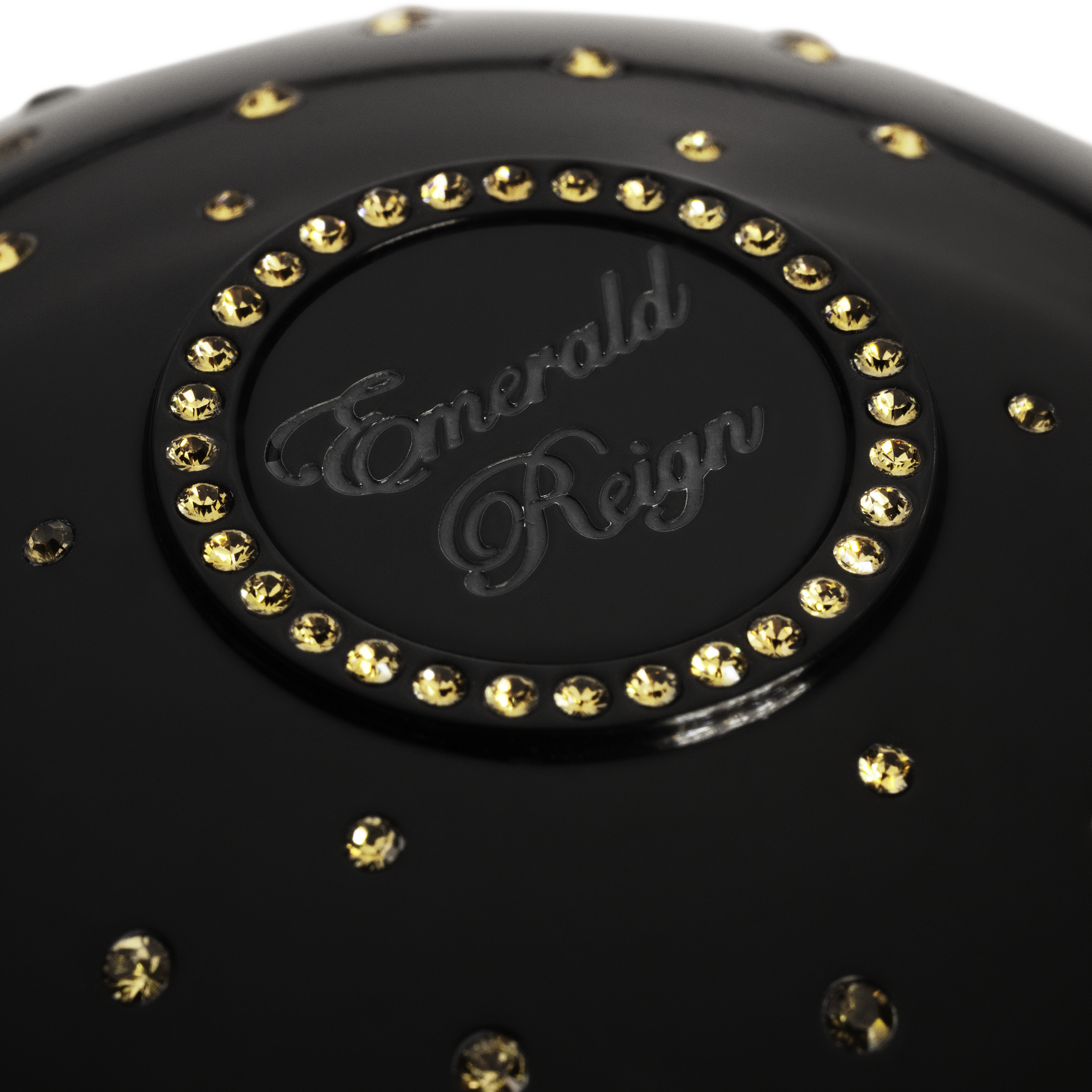 Black luxury fragrance cup with gold crystals  and 'Emerald Reign' branding 
