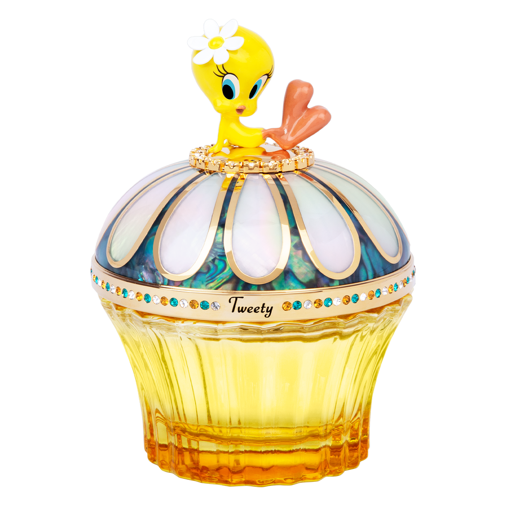 Tweety sitting on luxury fragrance bottle