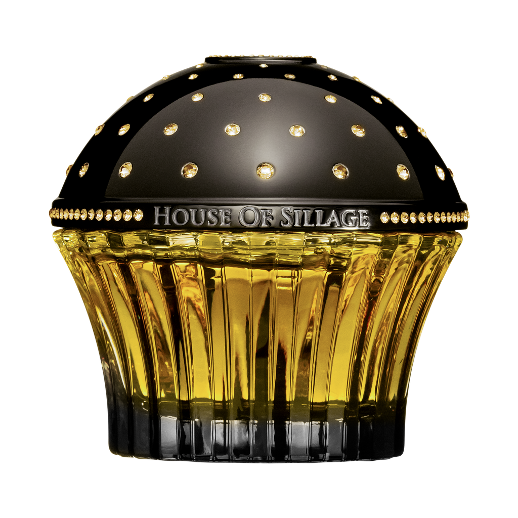 Oriental Parfume with Swarovski Crystals next to book
